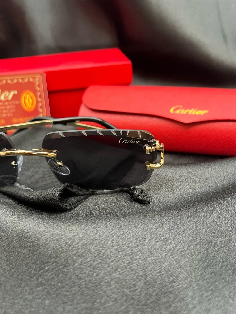 Cartier Men's Black & Gold Rimless Sunglasses with Scalloped Lenses